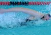 Megan Piotrowski of Rogers competes in the 50-yard freestyle at the Jones Center in Springdale for the 7A-West Conference Swimming and Diving Meet.