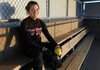 Springdale High’s Laura Worthen sits in the dugout Tuesday after practice at J.B. Hunt Park in Springdale. Worthen is a pitcher and four-year starter for the Lady Bulldogs.