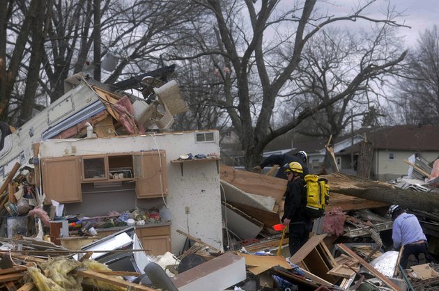 emergency-crews-comb-through-some-of-the-damage-after-a-severe-storm-hit-in-the-early-morning-hours-on-wednesday-feb-29-2012-in-harrisrbug-ill