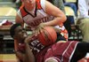 Gravette's Kyle Bilderback (top) and Dollarway's Devone Chapman scramble for a loose ball during their game Wednesday in the 4A state tournament.
