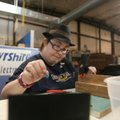 Tamara Trujillo of Springdale trims metal leads from capacitors last month at the Elizabeth Richards...