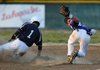 Hayden Guffey, Elkins senior, right, turns after tagging out Shiloh Christian freshman Josh Stephens on Monday at Elkins.