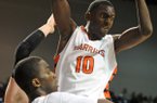 Little Rock Hall’s Bobby Portis pulls down a rebound in the first half of the 7A Boys State Championship game against Fayetteville.
