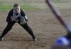 Madison Cluck, Prairie Grove, prepares to field a ball March 9 while playing Rogers High at Veterans Park in Rogers.