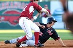 Arkansas infielder Bo Bigham forces out Gonzaga’s Travis Forbes at second base Tuesday, then throws to first to complete a double play in the second inning of the Razorbacks’ 1-0 victory at Baum Stadium. 