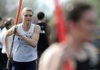 Payton Stumbaugh, Springdale Har-Ber, warms up on the pole vault pit during the Tiger Relays in Bentonville.