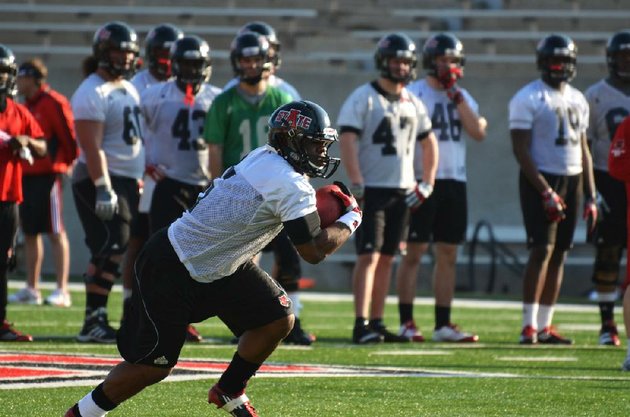 having-former-auburn-running-back-michael-dyer-at-arkansas-state-spring-practices-is-a-benefit-for-coach-gus-malzahn-since-dyer-was-part-of-the-same-offensive-scheme-with-the-tigers-malzahn-told-a-birmingham-radio-station-on-monday-morning-that-dyer-will-likely-redshirt-the-2012-season-for-asu