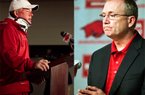 Arkansas football coach Bobby Petrino (left) was placed on paid administrative leave on Thursday by UA athletics director Jeff Long (right) after Petrino lied about details surrounding his motorcycle accident last Sunday. (AP Photos)