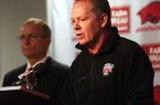 Former football Coach Bobby Petrino is shown last year with Athletic Director Jeff Long (left) at the Broyles Athletic Center on campus in Fayetteville.
