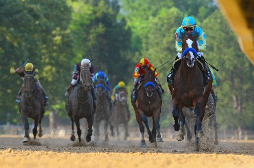 arkansas-democrat-gazettestephen-b-thornton-4142012-mike-smith-aboard-bodemeister-right-raises-up-as-he-crosses-the-finish-line-ahead-of-the-pack-to-win-the-arkansas-derby-during-saturday-afternoons-race-at-oaklawn-park-in-hot-springs