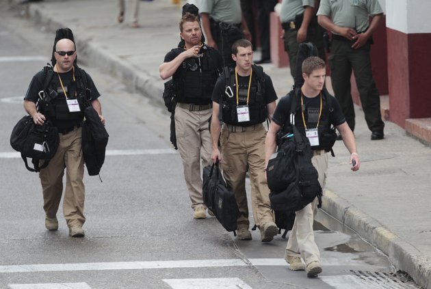 us-secret-service-agents-walk-around-the-convention-center-in-cartagena-colombia-prior-to-the-opening-ceremony-of-the-6th-summit-of-the-americas-at-the-convention-center-in-cartagena-colombia-saturday-april-14-2012-last-thursday-a-dozen-secret-service-agents-sent-to-provide-security-for-us-president-barack-obama-were-relieved-from-duty-and-replaced-with-other-agency-personnel-after-an-incident-of-alleged-misconduct