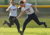 Kenzi Ziem, a Rogers Heritage center fielder, reaches for a ball hit to the outfield during the Lady War Eagles’ March 30 game with West Fork at Veterans Park in Rogers.