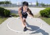 Heritage High’s Thomas Tran prepares to throw the shot put Wednesday while practicing at the Rogers school.