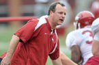 University of Arkansas Tim Horton works with the team during Friday afternoons practice at Razorback Stadium.