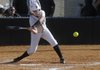 Bentonville’s Anna Thomas swings at a pitch Thursday while hosting Fayetteville. 