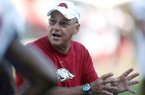 Former Arkansas assistant coach John L. Smith is returning to the Razorbacks’ program after being named head coach Monday.