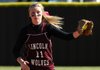 Morgan Reed of Lincoln High School looks to first base to see if the runner from West Fork High School was turning to second on April 23 in Lincoln.