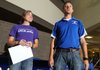 Jeremiah Tebbenkamp, right, Rogers girl’s sprint and jump coach, talks about Alex Dorch’s career as a Lady Mountie long jumper Wednesday. Dorch signed a letter of intent with the University of Central Arkansas.