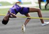 Dashala Morgan, Fayetteville junior, clears the bar Thursday while competing in the girl’s high jump during the 7A-West Conference track meet at Mountie Stadium in Rogers. The girls team took second at the meet. 