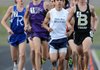 Dino Andrade of Springdale Har-Ber holds second place on the first lap of the boy’s 1,600-meter race Thursday during the 7A-West Conference track meet at Mountie Stadium in Rogers. Andrade finished second in the race. 