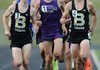Will Aenchbacher, left, and Dalton Davis, right, both of Bentonville, lead the pack on the second lap of the boy’s 1600-meter race Thursday. Aenchbacher finished third in the race and Davis took sixth.