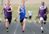Chase Lamers, center, of Rogers High leads Fayetteville’s Bradly Culp, left, and Travon Alexander in the boy’s 100-meter race Thursday during the 7A-West Conference track meet at Mountie Stadium in Rogers. Lamers took first place in the race with Culp in second and Alexander in third. 