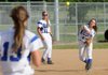 Cody Scoles, center, Rogers High, watches as teammate Ashley Ferguson, right, throws the ball to Ryan Vaughn at first base Friday during the game against Bentonville at Veterans Park in Rogers. 
