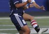 Ana Martinez, left, of Springdale Har-Ber fights for the ball with Rogers High’s Kate Schmandt on Friday at Mountie Stadium in Rogers. 