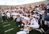 Fayetteville players celebrate after their 29-28 overtime win over Bentonivlle on Dec. 3 in the Class 7A state championship game in War Memorial Stadium in Little Rock.