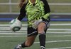 Emma Gartner of Springdale Har-Ber rolls the ball to a teammate on Friday at Mountie Stadium in Rogers.