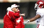 Arkansas Coach John L. Smith says he will let his coordinators do the play calling on both sides of the ball, but Smith will help out by supervising special teams. 