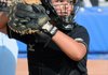 Bentonville High School’s Macey Brake looks back at a runner before throwing the ball to the pitcher Friday at Veterans Park in Rogers during the game against Rogers High School.