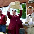 Toinette Madison, director of the Boone County Heritage Museum, holds a copy of the April 27, 1912, ...