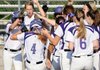 Fayetteville’s Brittany Hoskins is greeted at the plate by her teammates Tuesday following a two-run home run during the Lady Bulldogs’ game against Fort Smith Southside in Fayetteville.