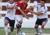 Har-Ber’s Rolando Sidon, left, and Dino Andrade, right, pressure Springdale High’s Jorge Gonzalez on Friday at Jarrell Williams Bulldog Stadium.
