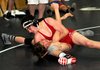 Aaron Grigsby, 15, top, from Bentonville High School gets a headlock on Har-Ber’s Dylan Collins, 17, in the 120-pound class in the state Freestyle Wrestling Tournament at Har-Ber High School in Springdale on Saturday. Collins won the match.