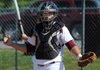 Lincoln’s Dustin Simmons looks to coaches for what pitch to signal during a game played earlier this season. The Wolves will open play in the Class 3A state tournament today in Prescott.