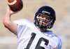 Reese Dollins, a Bentonville quarterback, passes the ball Thursday during the Tigers’ spring practice at Tiger Stadium in Bentonville. 