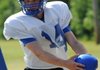 Rogers’ Max Harrell runs drills May 2 on the practice field behind Mountie Stadium. 