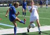 Brooke Baledge, right, of Fayetteville blocks a kick by Bailey Bevans of North Little Rock on Thursday at Southside High School in Fort Smith during game one of the Class 7A girls soccer state playoffs. Fayetteville shutout North Little Rock, 8-0. 
