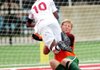 Springdale’s Carlos Chavez runs into Little Rock Central goalkeeper Hunter Weber during Saturday’s Class 7A boys semifinal game at Northside High School in Fort Smith. Springdale won 1-0.