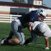 Peyton Squires, left, a Springdale Har-Ber linebacker, tackles wide receiver Miguel Salgado during practice May 10 at the school’s practice field.