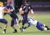 Austin Allen, Fayetteville junior quarterback, keeps the ball as he makes his way past James Maness, Little Rock Catholic junior linebacker, while Tyler Tuck, Fayetteville senior tight end, blocks Matt Morris, Catholic senior defensive end, on Nov. 11 at Harmon Field. The artificial turf at Harmon Field will be replaced at the conclusion of spring practice and is expected to be ready for Fayetteville’s fall workouts in August.
TIME FOR AN UPGRADE