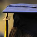 A 2012 charm dangles from a Shiloh Christian School graduating senior’s tassel and mortarboard Thurs...