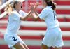 Bentonville’s McKenzie Dixon, right, celebrates with teammate Taylor Parsons on Friday after scoring in the first half of the Class 7A Girls State Soccer Championship at Razorback Field in Fayetteville