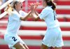 Bentonville’s McKenzie Dixon (right) celebrates with teammate Taylor Parsons after scoring the lone goal Friday in the Tigers’ 1-0 victory over Conway to win the Class 7A girls soccer championship in Fayetteville. 