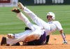 Shiloh Christian’s David Petrino (right) collides with Lonoke shortstop Spencer Gooden as Petrino tries to stretch a single into a double during the third inning Saturday at Baum Stadium. 