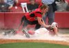 White Hall pitcher Sydnee Clark attempts to tag out Vilonia’s Ashley Lyons at home plate during the second inning of Saturday’s Class 5A state softball championship game at Bogle Park in Fayetteville. White Hall defeated Vilonia 5-2.