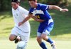 Will Easley of Siloam Springs (left) battles for the ball with Hot Springs Lakeside’s Timothy Carroll during the Panthers’ 2-0 victory over the Rams on Saturday in the Class 5A boys soccer championship game in Fayetteville. 