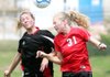 Russellville’s Shannon Hocker (left) competes for a header with Searcy’s Autumn Tobin (31) during the Cyclones’ 3-0 victory Saturday at Razorback Field in Fayetteville. 